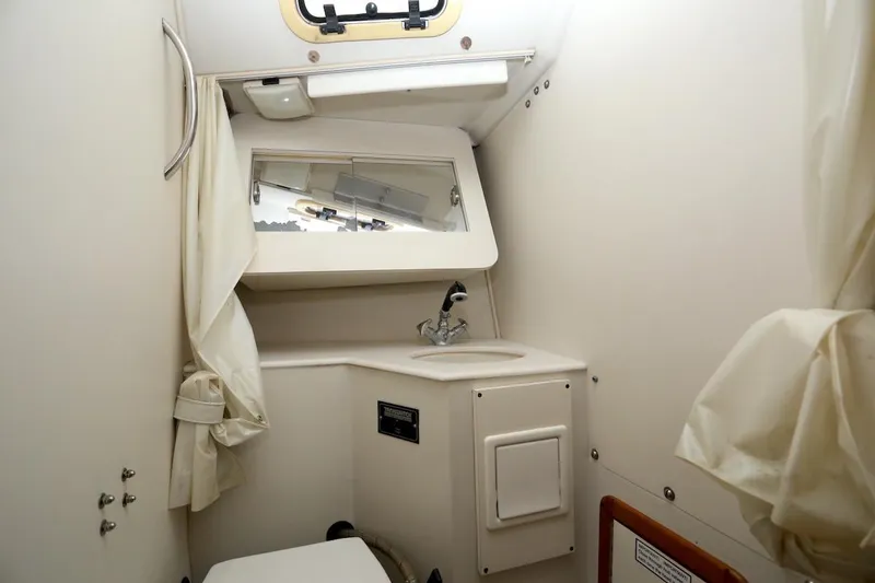 Slide: The Image of Interior of a 1995 Catalina 30 yacht with sink and mirror. - 27
