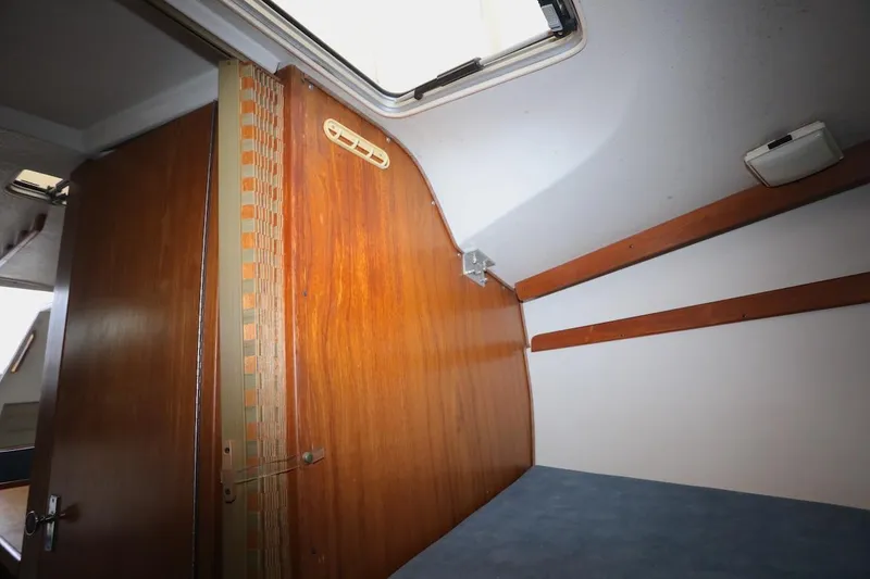 Slide: The Image of Interior of a 1995 Catalina 30 yacht with wooden doors. - 29