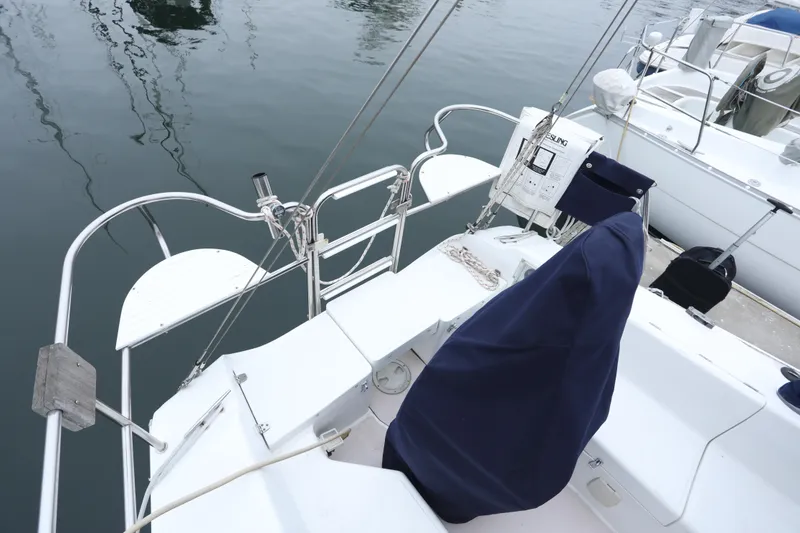 Slide: The Image of Aft view of a 1995 Catalina 30 sailboat in harbor. - 3