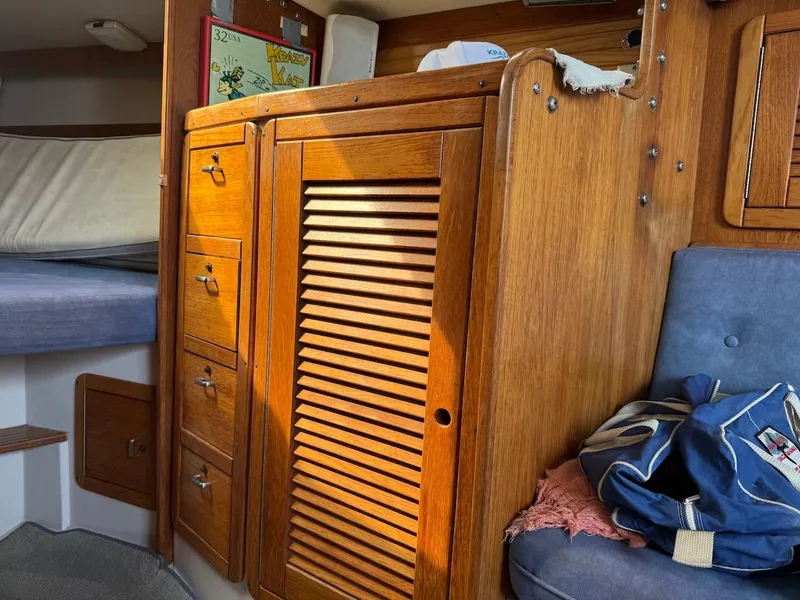 Slide: The Image of Interior of a 1995 Catalina 30 yacht with wooden cabinetry. - 31