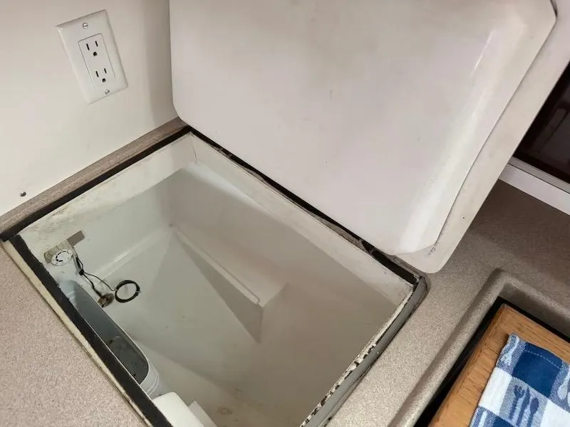 Slide: The Image of Open storage compartment in a 1995 Catalina 30 yacht. - 37