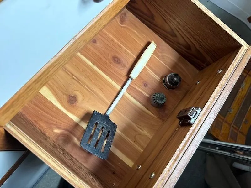 Slide: The Image of Wooden drawer with spatula and metal parts, Catalina 30, 1995. - 38