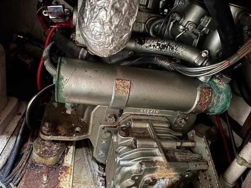 Slide: The Image of Engine compartment of a 1995 Catalina 30 boat with visible wiring. - 41