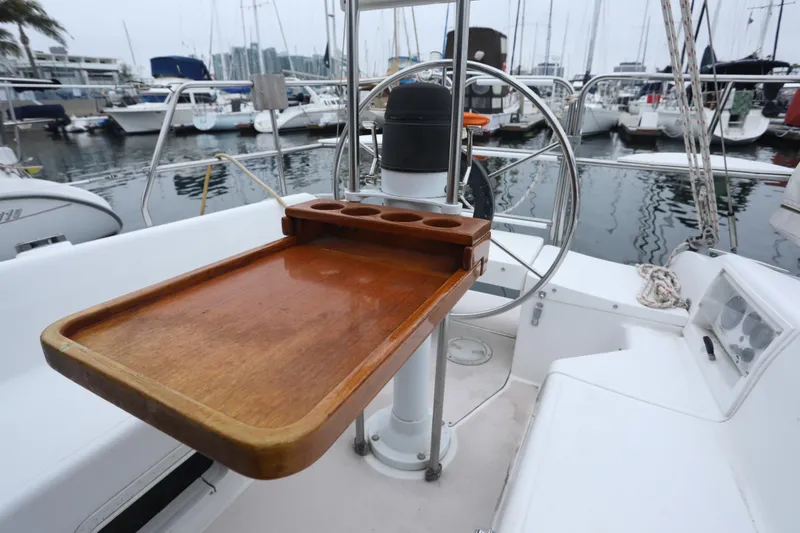 Slide: The Image of Cockpit of a 1995 Catalina 30 sailboat with wooden table. - 8