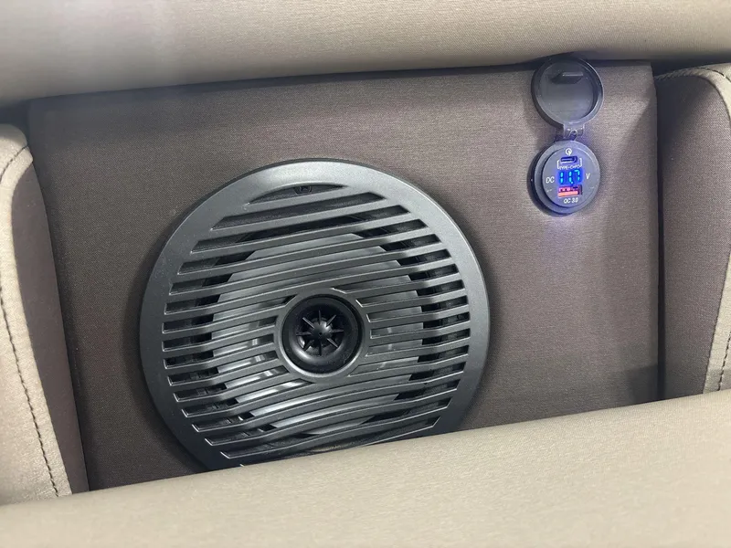Slide: The Image of Speaker and USB port on 2022 Bennington 25QXSBWA boat interior. - 14