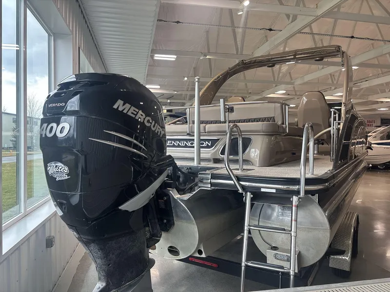 Slide: The Image of 2022 Bennington 25QXSBWA pontoon boat with Mercury 400 Verado engine in showroom. - 3