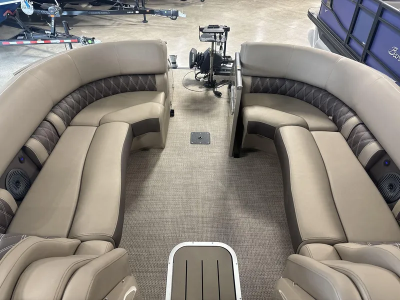 Slide: The Image of Luxurious seating on 2022 Bennington 25QXSBWA pontoon boat, featuring plush, curved upholstery. - 5