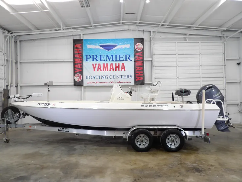 Slide: The Image of 2018 Skeeter SX2250 boat on trailer at Premier Yamaha Boating Center. - 1