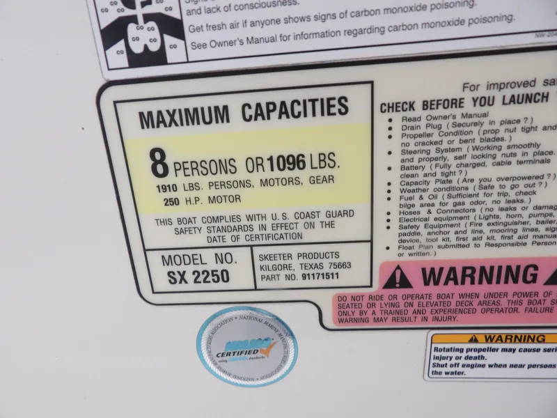Slide: The Image of 2018 Skeeter SX2250 capacity label showing limits: 8 persons, 1096 lbs, 250 HP motor. - 12