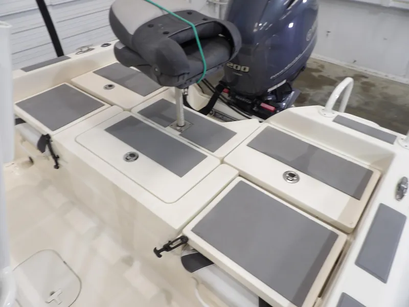 Slide: The Image of 2018 Skeeter SX2250 boat interior with seating and Yamaha outboard motor. - 16