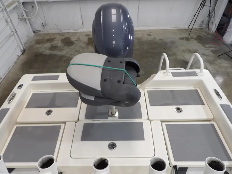 Slide: The Image of 2018 Skeeter SX2250 boat deck with motor and storage compartments. - 18