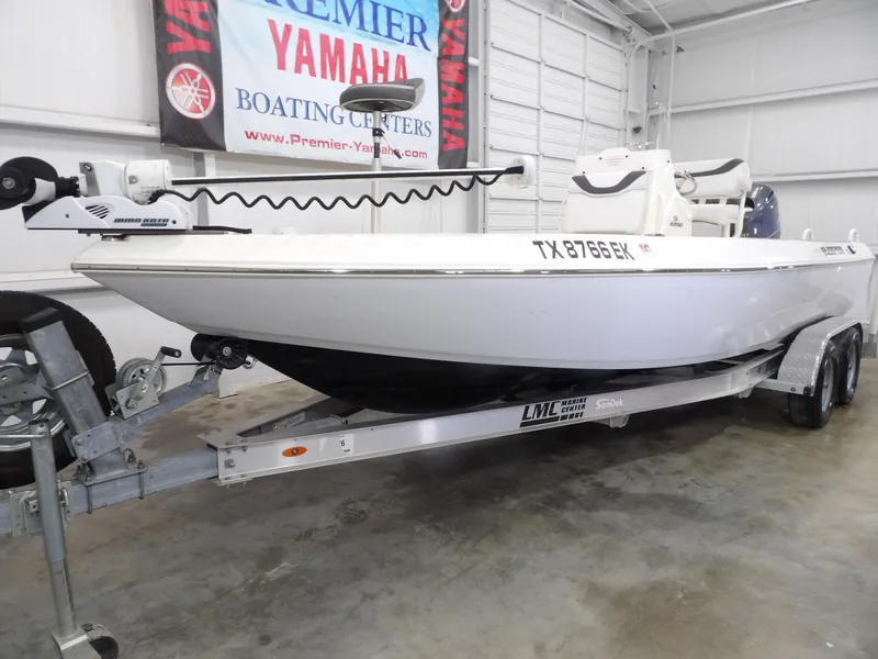 Slide: The Image of 2018 Skeeter SX2250 boat on trailer in showroom with Yamaha banner. - 3