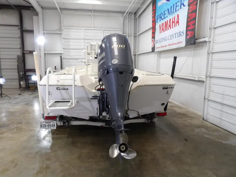 Slide: The Image of 2018 Skeeter SX2250 boat with Yamaha engine in a showroom. - 8