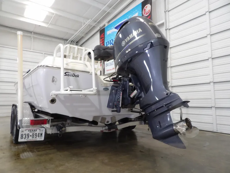 Slide: The Image of 2018 Skeeter SX2250 boat with Yamaha outboard motor in a garage. - 9