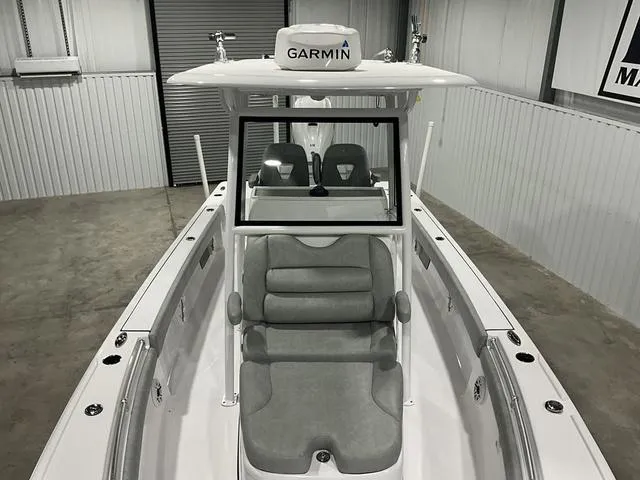 Slide: The Image of 2020 Sportsman Masters 267OE boat with Garmin equipment in a garage setting. - 12