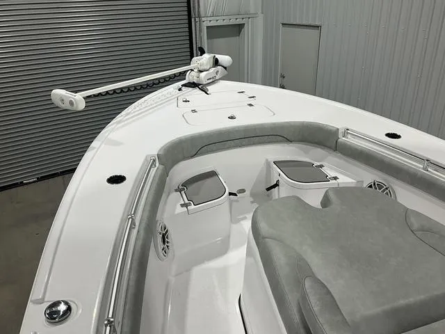 Slide: The Image of 2020 Sportsman Masters 267OE boat interior with seating and storage compartments. - 13