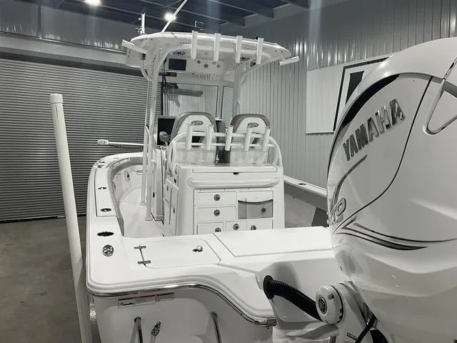Slide: The Image of 2020 Sportsman Masters 267OE boat with Yamaha engine in a garage setting. - 17