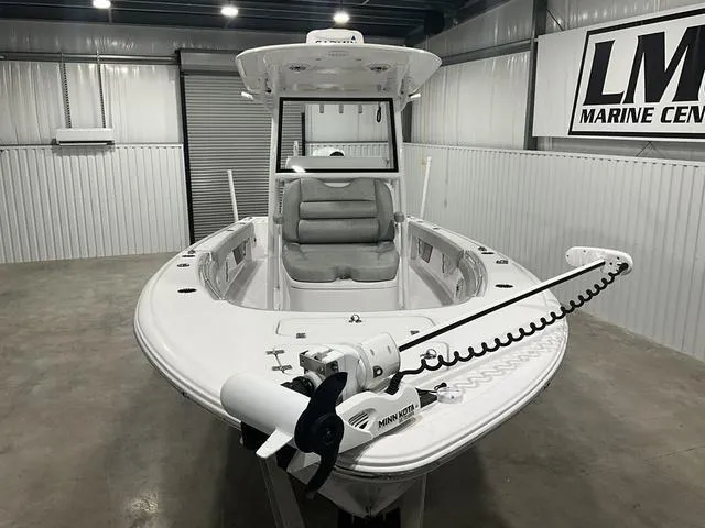 Slide: The Image of 2020 Sportsman Masters 267OE boat in showroom, featuring Minn Kota trolling motor. - 7