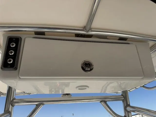 Slide: The Image of 2017 Sportsman Heritage 211 boat console with storage compartment and stainless steel frame. - 11