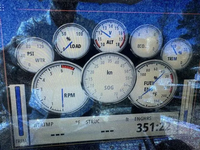 Slide: The Image of Dashboard of a 2017 Sportsman Heritage 211 boat showing various gauges and readings. - 12