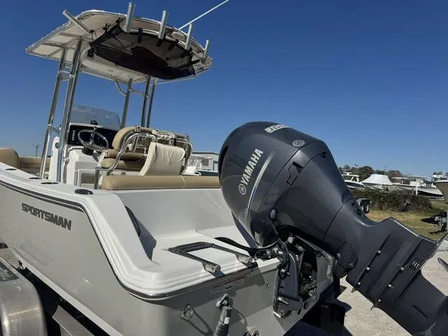 Slide: The Image of 2017 Sportsman Heritage 211 boat with Yamaha outboard motor, parked on a trailer. - 3