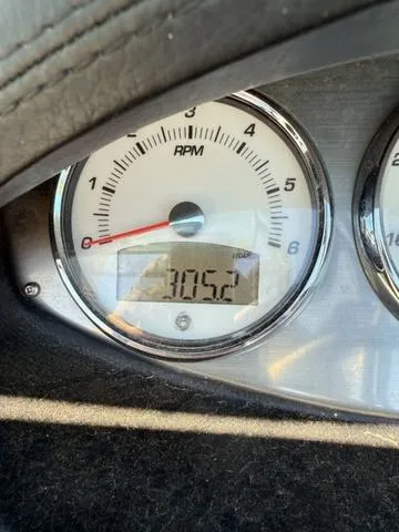 Slide: The Image of Close-up of a 2015 Supreme S226 RPM gauge displaying 3052 RPM. - 14