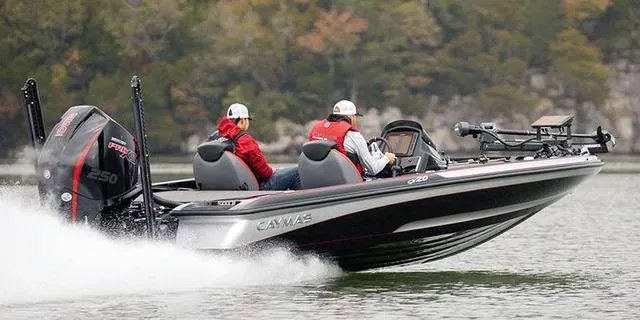 Slide: The Image of 2025 Caymas CX20 Pro boat speeding on a lake with two passengers. - 1