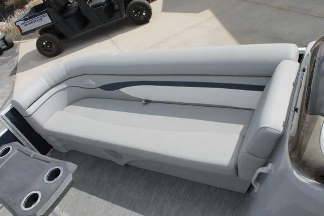 Slide: The Image of 2023 Bennington 21 SSR boat interior with gray seating and cup holders. - 10