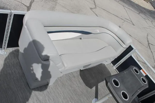 Slide: The Image of 2023 Bennington 21 SSR boat interior with gray seating and cup holders. - 11