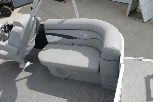 Slide: The Image of 2023 Bennington 21 SSR boat interior with gray seating and modern design. - 6