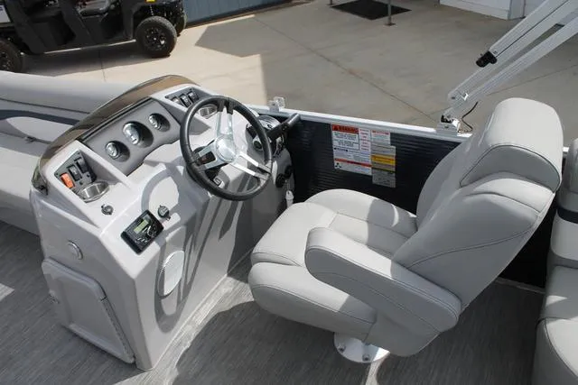 Slide: The Image of 2023 Bennington 21 SSR boat interior with steering console and captain's chair. - 8
