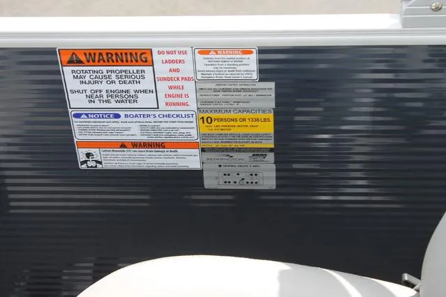 Slide: The Image of Warning labels on 2023 Bennington 21 SSR boat, highlighting safety and capacity guidelines. - 9