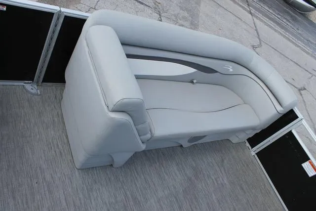 Slide: The Image of 2023 Bennington 21 SL boat interior with gray seating and sleek design. - 11
