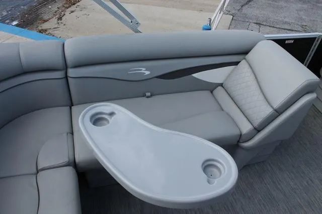 Slide: The Image of 2023 Bennington 21 SL boat interior with gray seating and cup holders. - 7