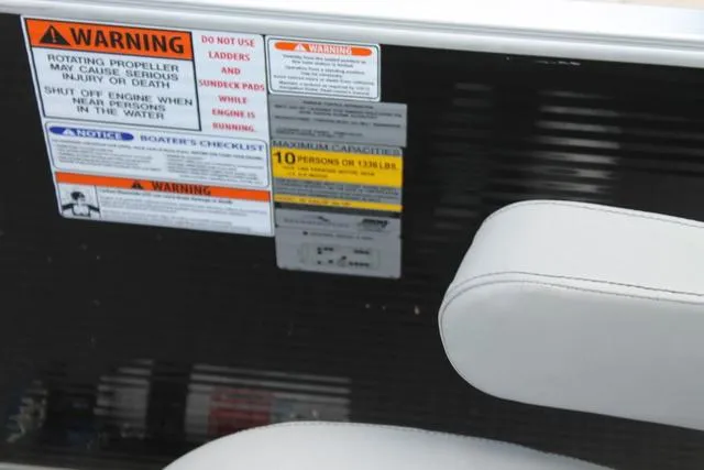 Slide: The Image of 2023 Bennington 21 SL boat warning labels and seating detail. - 9
