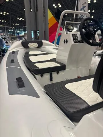 Slide: The Image of Highfield SP360 2025 boat seating with quilted upholstery and modern design. - 2