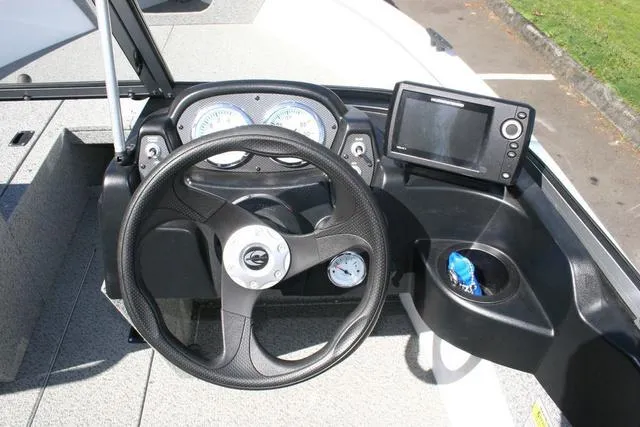 Slide: The Image of 2023 Crestliner 1700 Vision boat dashboard with steering wheel and navigation system. - 8