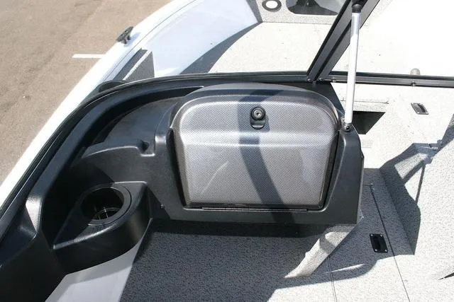 Slide: The Image of 2023 Crestliner 1700 Vision boat interior with storage compartment and cup holder. - 9