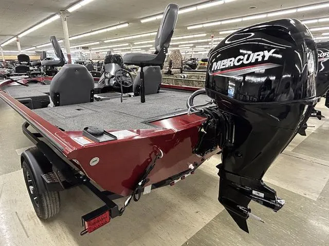 Slide: The Image of 2025 Lowe Stinger 175C boat with Mercury outboard motor in showroom. - 11