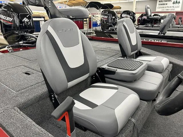 Slide: The Image of 2025 Lowe Stinger 175C boat interior with gray and white seating, showcasing modern design. - 5