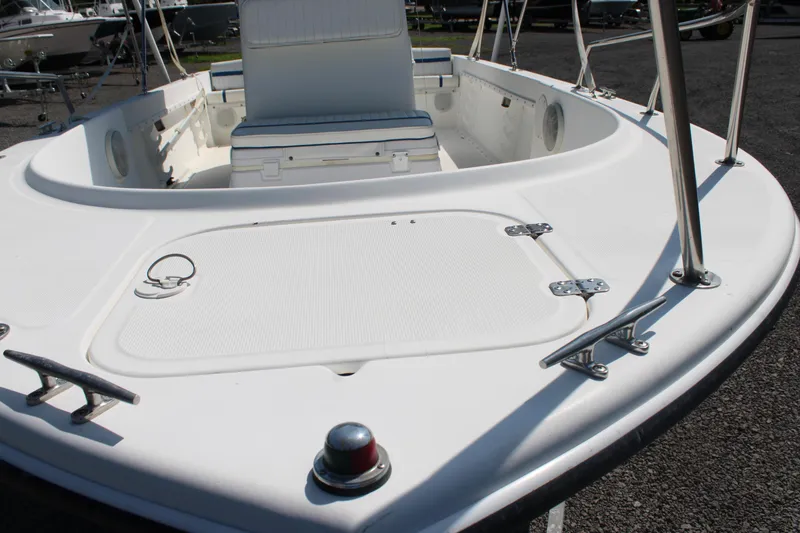 Slide: The Image of 1999 Edgewater 20cc boat deck with seating and storage compartments. - 5