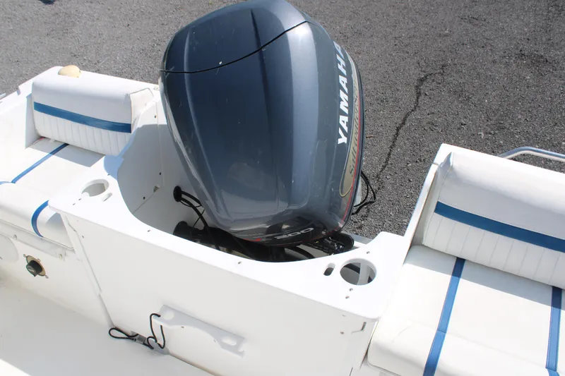 Slide: The Image of 1999 Edgewater 20cc boat with Yamaha outboard motor, white and blue seating. - 8