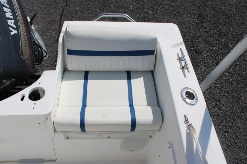 Slide: The Image of 1999 Edgewater 20cc boat seat with blue-striped upholstery and Yamaha motor. - 9