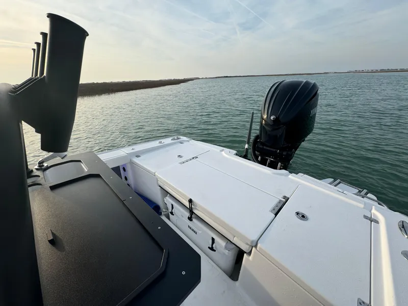 Slide: The Image of 2025 Crevalle 24 HCO boat on water, featuring sleek design and powerful outboard motor. - 39