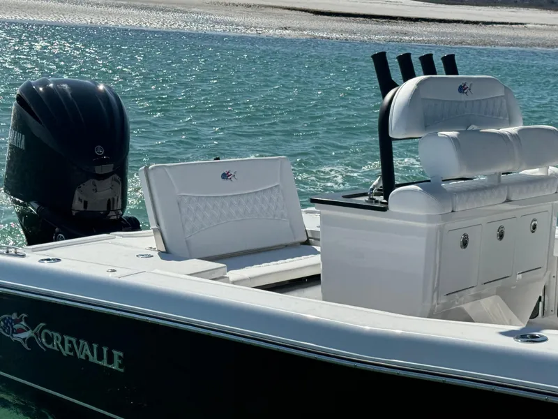 Slide: The Image of 2025 Crevalle 24 HCO boat with Yamaha outboard engine on clear water. - 42