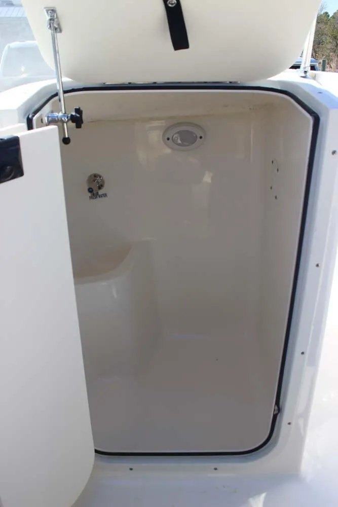 Slide: The Image of 2020 Key West 203 DFS boat storage compartment with open hatch. - 15