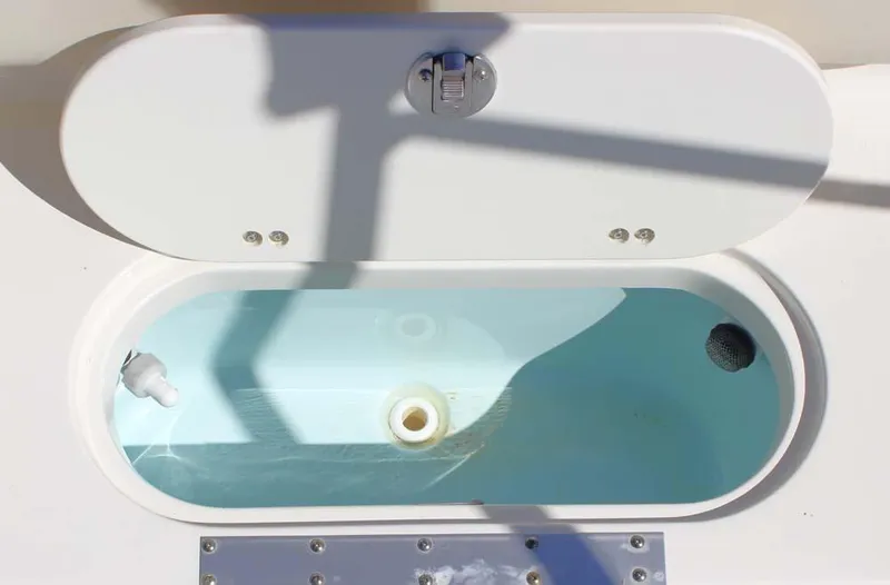 Slide: The Image of Open livewell on 2020 Key West 203 DFS boat, showing water and drain. - 19