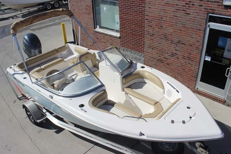 Slide: The Image of 2020 Key West 203 DFS boat on trailer, parked near brick building. - 3