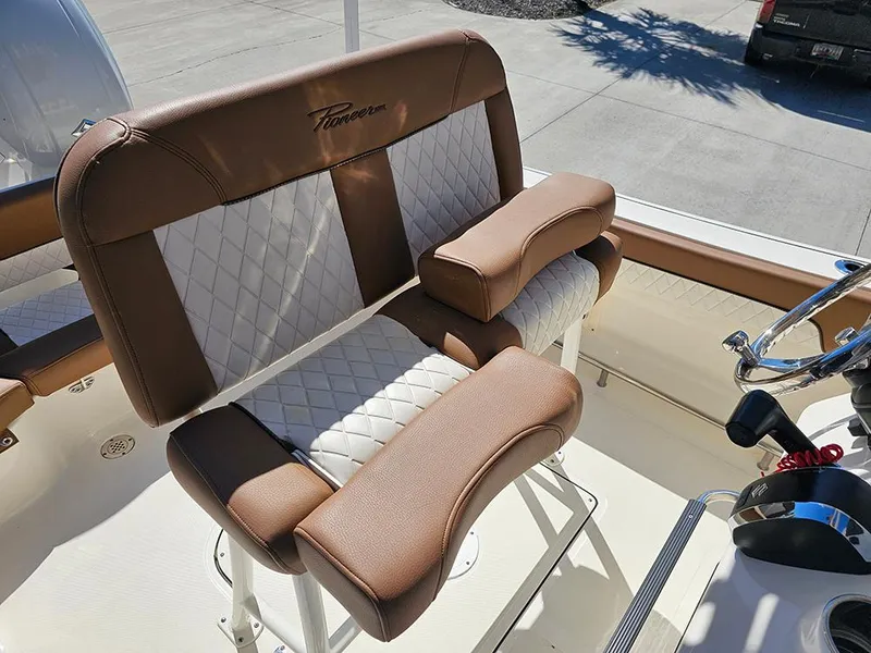 Slide: The Image of 2023 Pioneer 202 Islander boat seat with brown and white cushioned design. - 14