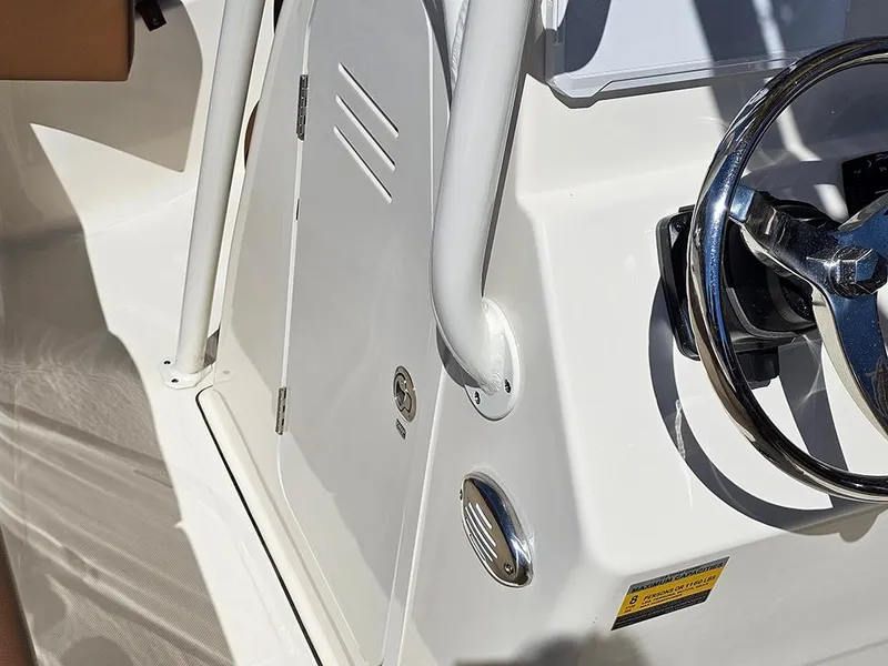 Slide: The Image of 2023 Pioneer 202 Islander boat console with steering wheel and control panel. - 15